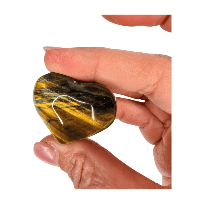 Tiger’s Eye heart carving with golden and blue tones for balance, strength, and clarity