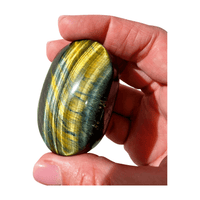 Tiger’s Eye palm stone for strength, courage, confidence, and grounding