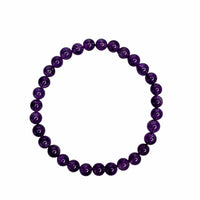 A beaded stretch bracelet made of polished, round purple gemstone beads, arranged in a circular shape against a solid white background.