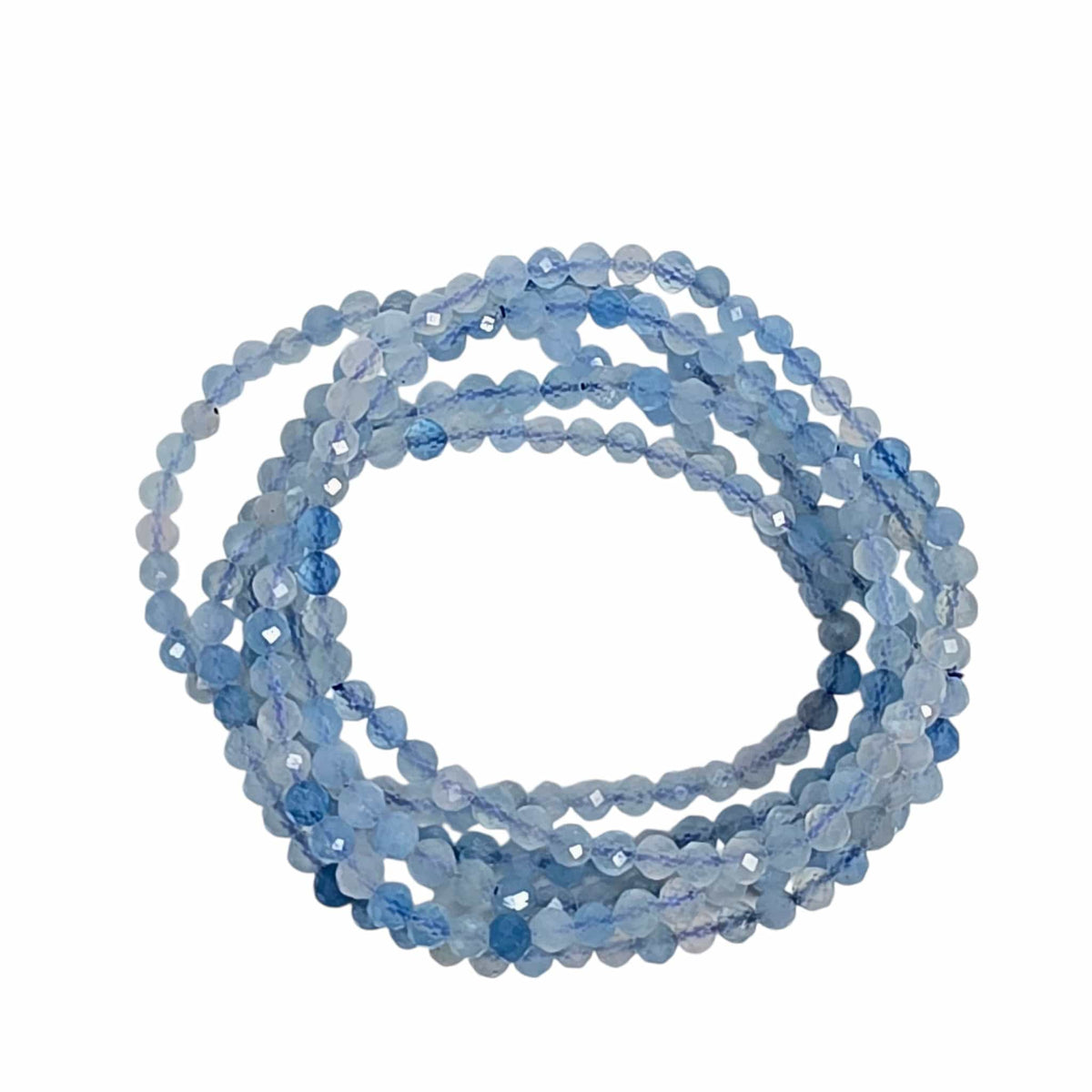 A coiled strand of faceted light blue beads on a plain white background.