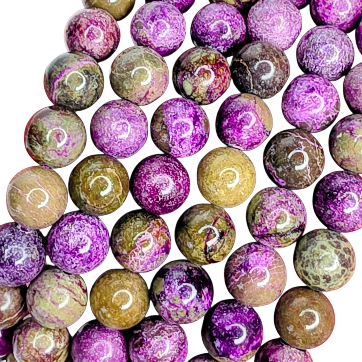 A close-up of round polished gemstone beads with swirling patterns in purple, pink, brown, beige, and olive green on a white background.