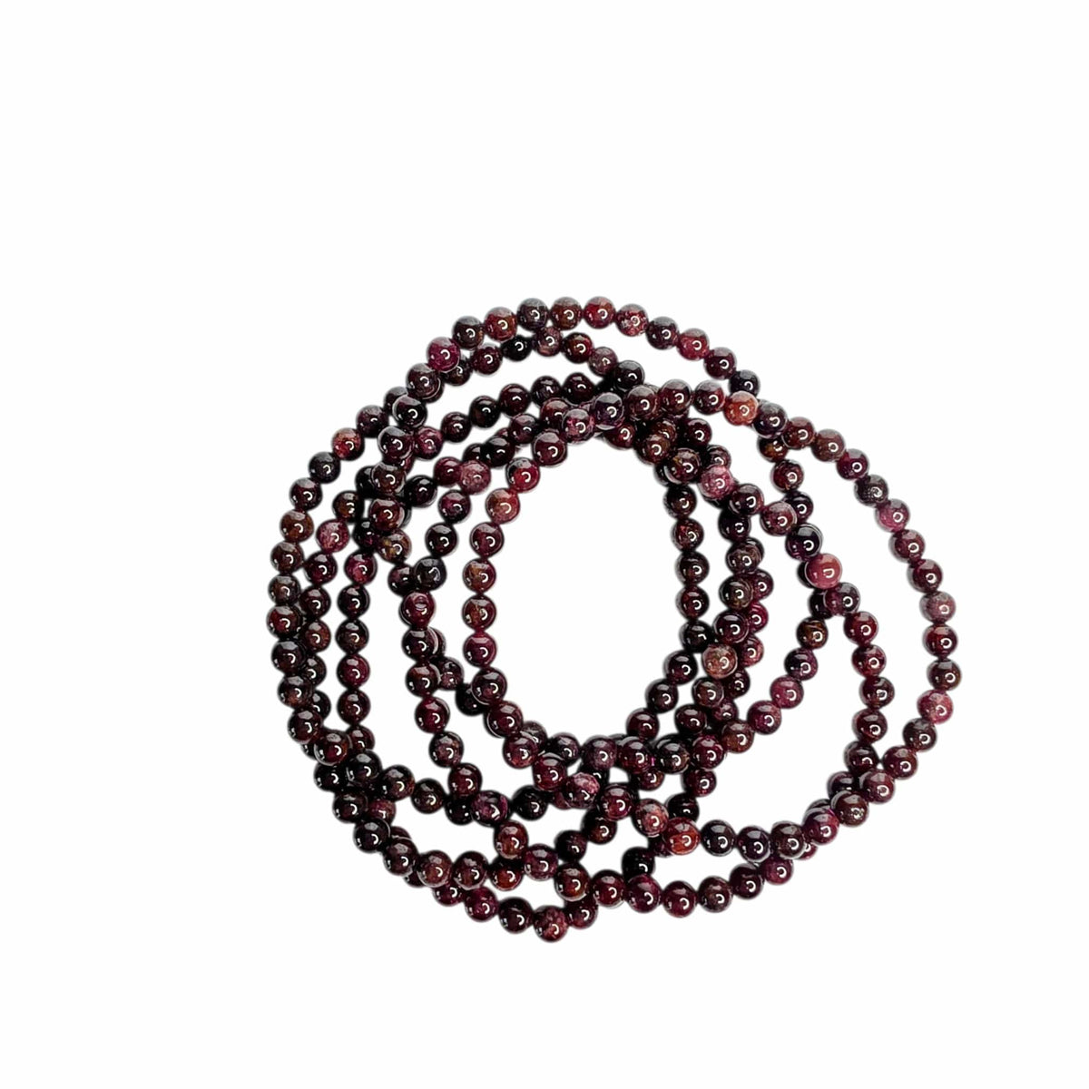 A long strand of polished dark red and black round beads, coiled in a spiral shape against a plain white background.