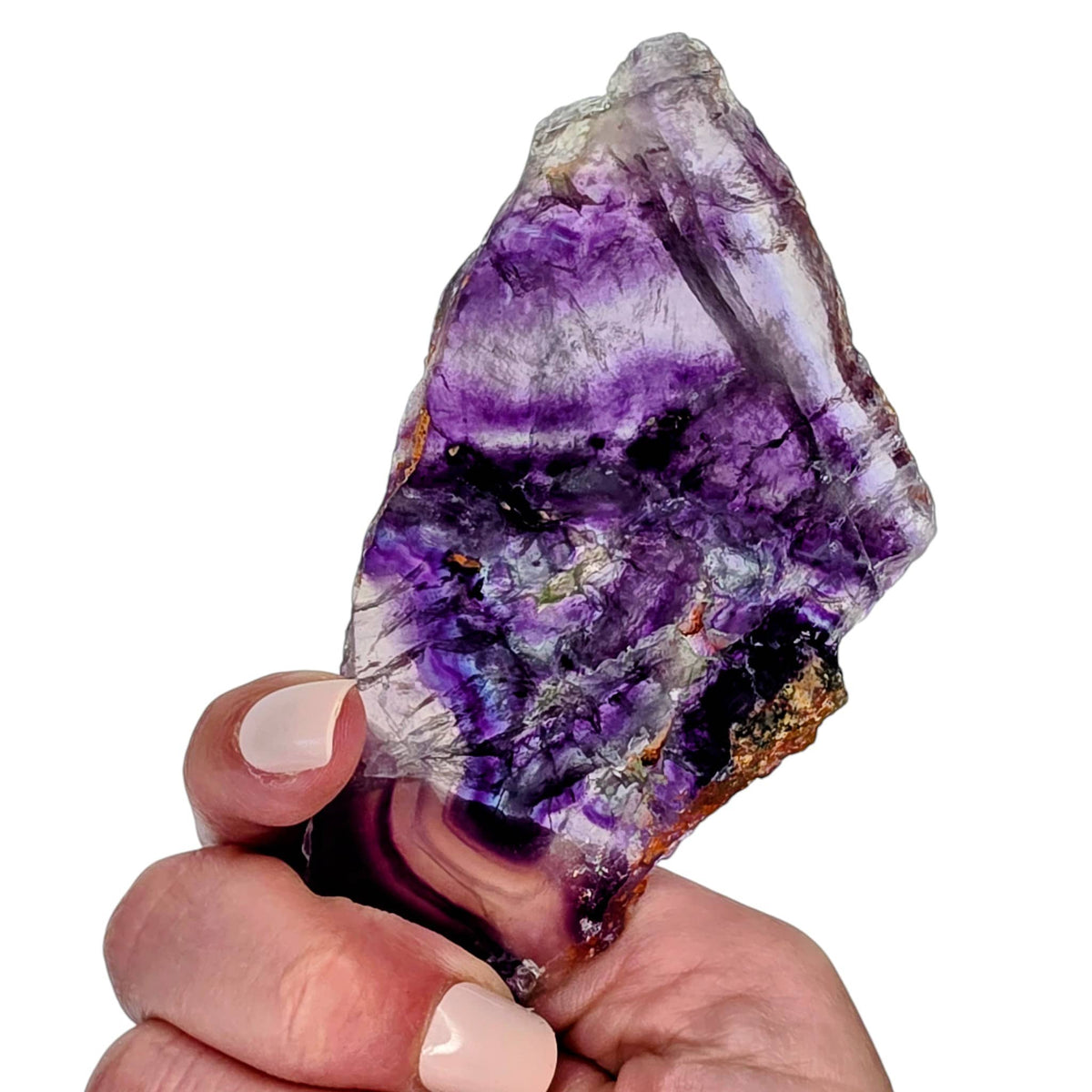 Fluorite slab fragment with purple crystal tones and blue-white streaks